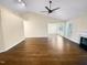 Bright open-concept living room featuring hardwood floors, vaulted ceiling, and fireplace at 10 Cricket Hollow Run, Clayton, NC 27520