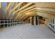 Large unfinished attic space featuring exposed rafters and beams, offering ample potential for customization at 10119 Second Star Ct, Raleigh, NC 27613