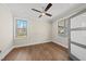 Bright bedroom featuring hardwood floors, neutral walls, and plenty of natural light at 10119 Second Star Ct, Raleigh, NC 27613