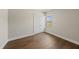 Bright bedroom with hardwood floors, fresh paint, closet, and window letting in natural light at 10119 Second Star Ct, Raleigh, NC 27613