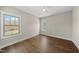 Bedroom with hardwood floors, neutral walls, and ample natural light at 10119 Second Star Ct, Raleigh, NC 27613