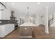 Spacious kitchen featuring a large island, stainless steel appliances, and open floor plan at 10119 Second Star Ct, Raleigh, NC 27613