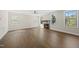 Bright living room featuring hardwood floors, a fireplace, and large windows at 10119 Second Star Ct, Raleigh, NC 27613