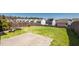 A quaint fenced backyard with a lawn and concrete patio at 1019 Thoughtful Spot Ln, Durham, NC 27703