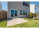 The backyard features a concrete patio and sliding glass doors at 1019 Thoughtful Spot Ln, Durham, NC 27703