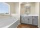 Bright bathroom with soaking tub and modern vanity at 1019 Thoughtful Spot Ln, Durham, NC 27703