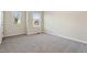 This bedroom has neutral walls, plush carpet, and windows with blinds at 1019 Thoughtful Spot Ln, Durham, NC 27703