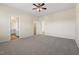 Bright bedroom features neutral carpet, ceiling fan and ensuite bathroom access at 1019 Thoughtful Spot Ln, Durham, NC 27703