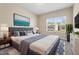 Serene bedroom features a comfortable bed, soft lighting, and a picturesque window view at 1019 Thoughtful Spot Ln, Durham, NC 27703