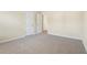 This bedroom features neutral carpet and a connected doorway at 1019 Thoughtful Spot Ln, Durham, NC 27703