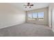 Large bedroom with neutral carpet and three large windows at 1019 Thoughtful Spot Ln, Durham, NC 27703