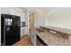 Modern kitchen featuring granite countertops and stainless steel appliances at 1019 Thoughtful Spot Ln, Durham, NC 27703