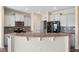 Bright kitchen featuring granite countertops, stainless appliances, and gray cabinets at 1019 Thoughtful Spot Ln, Durham, NC 27703