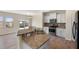 Spacious kitchen featuring granite countertops, stainless appliances, and a breakfast nook at 1019 Thoughtful Spot Ln, Durham, NC 27703