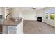 Open concept living area featuring wood flooring, fireplace and granite countertops at 1019 Thoughtful Spot Ln, Durham, NC 27703