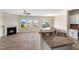 Open concept living area featuring wood flooring, fireplace and granite countertops at 1019 Thoughtful Spot Ln, Durham, NC 27703