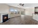 Living room with fireplace and ample natural light from large windows and open access to kitchen at 1019 Thoughtful Spot Ln, Durham, NC 27703
