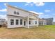 Home with a covered patio, perfect for outdoor entertaining and relaxation in the backyard at 104 Black Walnut Dr # 202, Garner, NC 27529