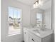 Bright bathroom featuring a double vanity with a large mirror and natural light from a window at 104 Black Walnut Dr # 202, Garner, NC 27529