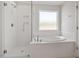This bathroom features a separate shower, and a soaking tub at 104 Black Walnut Dr # 202, Garner, NC 27529