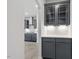Stylish butler's pantry with dark cabinetry, granite countertops, and subway tile backsplash at 104 Black Walnut Dr # 202, Garner, NC 27529