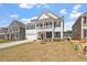 Beautiful two-story home with classic design, covered porch, and a well-manicured lawn at 104 Black Walnut Dr # 202, Garner, NC 27529