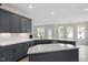 Modern kitchen features shaker cabinets, stainless steel appliances and quartz countertops at 104 Black Walnut Dr # 202, Garner, NC 27529