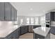 Modern kitchen features shaker cabinets, stainless steel appliances and quartz countertops at 104 Black Walnut Dr # 202, Garner, NC 27529