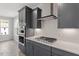Modern kitchen features shaker cabinets, stainless steel appliances and quartz countertops at 104 Black Walnut Dr # 202, Garner, NC 27529