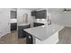 Modern kitchen with quartz countertops, stainless steel appliances, and ample cabinet space at 104 Black Walnut Dr # 202, Garner, NC 27529
