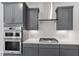 Modern kitchen features shaker cabinets, stainless steel appliances and quartz countertops at 104 Black Walnut Dr # 202, Garner, NC 27529