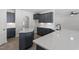 Modern kitchen features shaker cabinets, stainless steel appliances and quartz countertops at 104 Black Walnut Dr # 202, Garner, NC 27529
