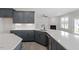Modern kitchen features shaker cabinets, stainless steel appliances and quartz countertops at 104 Black Walnut Dr # 202, Garner, NC 27529