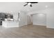 Open-concept kitchen with stainless steel appliances, grey cabinets, and a breakfast bar for casual dining at 104 Black Walnut Dr # 202, Garner, NC 27529