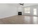 Open concept living room features a fireplace and lots of natural light at 104 Black Walnut Dr # 202, Garner, NC 27529