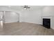 Spacious living room features a fireplace, neutral paint, and wood-look flooring with lots of natural light at 104 Black Walnut Dr # 202, Garner, NC 27529