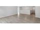 An open-concept living room with light wood-style flooring at 104 Black Walnut Dr # 202, Garner, NC 27529