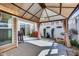 Outdoor patio featuring a covered gazebo, BBQ grill, privacy fence, and a sliding glass door at 1064 Blue Bird Ln, Wake Forest, NC 27587