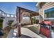 Outdoor patio featuring a covered gazebo, grill, and a white privacy fence at 1064 Blue Bird Ln, Wake Forest, NC 27587