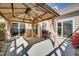 Outdoor patio featuring a covered gazebo, grill, and sliding doors at 1064 Blue Bird Ln, Wake Forest, NC 27587