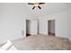 Spacious bedroom with carpeted floors, ceiling fan, two entrances, and natural light at 1064 Blue Bird Ln, Wake Forest, NC 27587