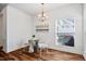 Cozy breakfast nook with a chandelier, small table with two chairs, and a window, perfect for enjoying casual meals at 1064 Blue Bird Ln, Wake Forest, NC 27587
