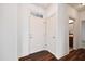 Bright foyer featuring a white door, hardwood floors, and white trim at 1064 Blue Bird Ln, Wake Forest, NC 27587