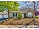 Charming home showcasing siding, stone accents, and well-maintained front yard landscaping at 1064 Blue Bird Ln, Wake Forest, NC 27587