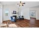 Inviting living room with a fireplace, comfortable seating, and a ceiling fan for added comfort and style at 1064 Blue Bird Ln, Wake Forest, NC 27587