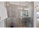 Modern tiled shower featuring glass door, built in seating, with natural lighting at 1064 Blue Bird Ln, Wake Forest, NC 27587