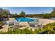 Community pool and lounge area with tables and chairs for residents to relax and enjoy at 1064 Blue Bird Ln, Wake Forest, NC 27587
