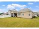 Expansive backyard features a well-manicured lawn, screened-in porch and white privacy fence at 124 Alta Crest Ln, Garner, NC 27529
