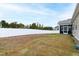 Wide backyard with privacy fence, providing a secure and private outdoor space for relaxation and enjoyment at 124 Alta Crest Ln, Garner, NC 27529