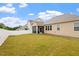 Grassy backyard bordered by a modern white fence, offering privacy and a serene outdoor space at 124 Alta Crest Ln, Garner, NC 27529